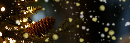 Spruce branch with pine cone, garland and many glowing lights. Symbol of christmas and new year in foreground.の写真素材