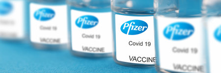 Minsk, Belarus - November 21 2020: Glass vial with coronavirus covid 19 vaccine from pfizer closeup. Illustrative editorial.のeditorial素材