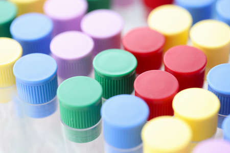 Closeup of multicolored test tubes in chemical laboratory. PCR diagnostics covid 19 conceptの写真素材