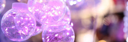Transparent Christmas balls with colored lights inside. Decorations for Christmas conceptの写真素材