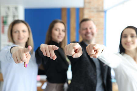Business people team pointing with index fingers at you closeupの写真素材