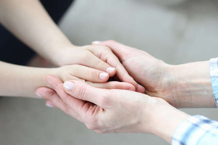 Women and children hands joined together closeupの写真素材