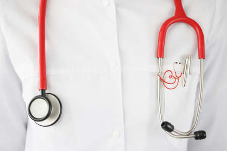 Red stethoscope hanging on doctor neck closeupの写真素材