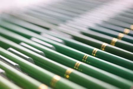 Set of green wooden pencils in different shades closeupの写真素材