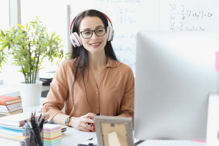 Confident female mentor will enter recording of math presentation