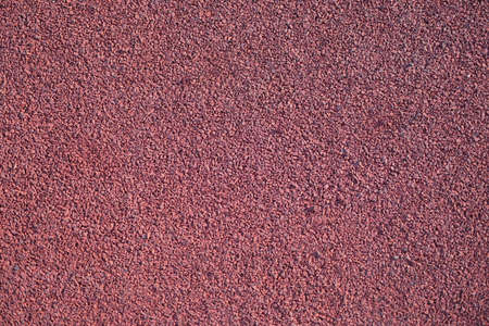 Closeup of red rubber floor covering for playgroundの写真素材