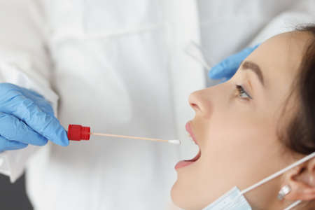 Doctor in front of biological material of saliva from patient for diagnosis