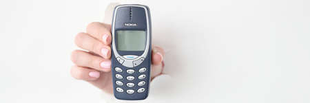 Female hand hold button phone Nokia 3310のeditorial素材