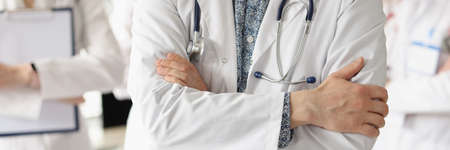 Team of doctors is standing in medical office. Professional medical care specialists concept