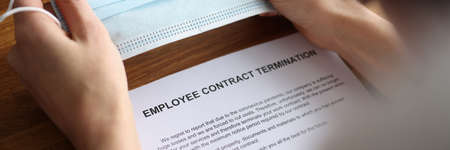 Employee received contract termination notice in virus pandemicの写真素材