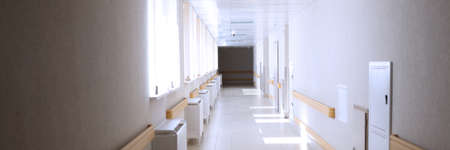Light empty spacious corridor in medical facilityの写真素材