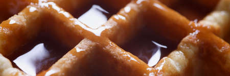 Closeup of delicious Viennese waffles with caramel syrupの写真素材