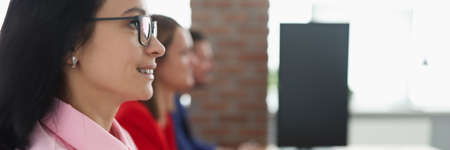 Business people are sitting at working table in office