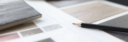 Catalog with samples of wood flooring is on tableの写真素材