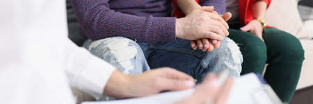 Problematic couple at reception and psychologist closeupの写真素材