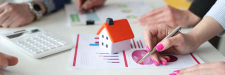 Business agents discussing real estate sales statistics closeupの写真素材