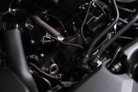 Closeup of electronics and engine under hood of carの写真素材