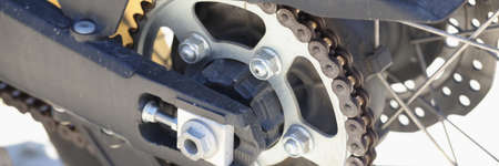 Detail of the rear chain of motorcycle with brake discの写真素材