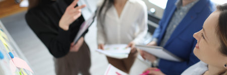 Business partners discuss commercial performance of companyの写真素材