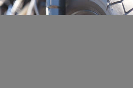 Closeup of metal brake disc on motorcycle wheelの写真素材