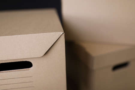 Closeup of many brown cardboard storage boxesの写真素材