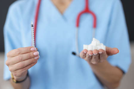 Insulin syringe and refined sugarの写真素材