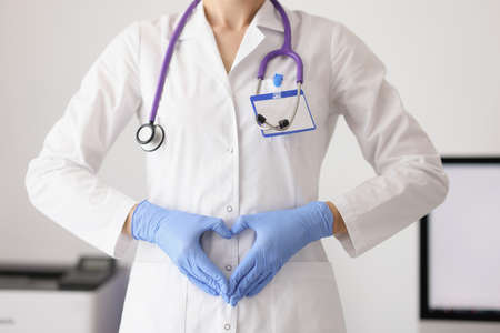 Woman showing heart sign with handsの写真素材