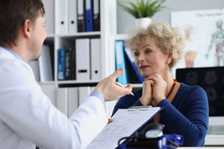 Elderly lady listen to medical worker