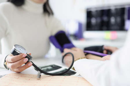 Close-up of female hand holding tonometerの写真素材