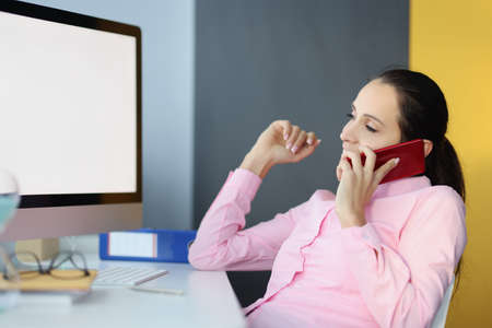 Portrait of smiling woman talking on smartphone
