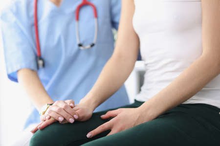 Practitioner supporting sick patient after bad news.の写真素材