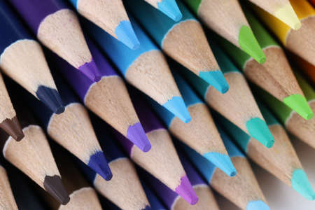 Sharpened pencils for drawing laying on each other forming stack