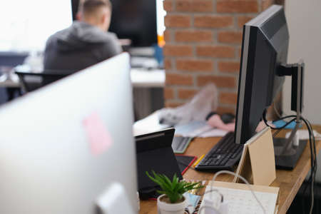 Modern workplace of office workers with computerの写真素材