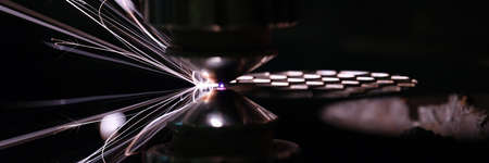 Closeup of laser head cutting iron sheetの写真素材