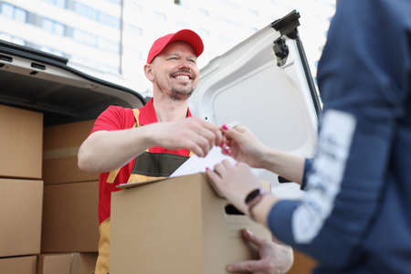 Courier and receiver make trade with signature on document for order