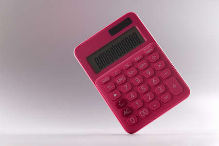 Closeup of pink calculator on gray backgroundの写真素材