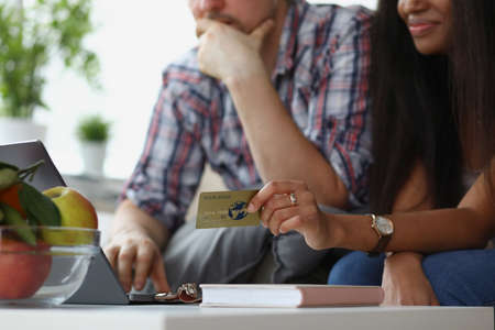 Wife and husband want to buy something online via credit card paymentの写真素材