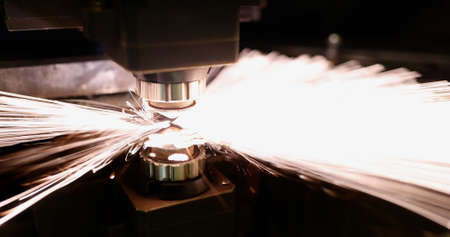 Neon sparks fly of machine head for metal processing laser metalの写真素材