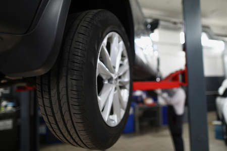 Brand new automobile tire, changed part of vehicle in service centre