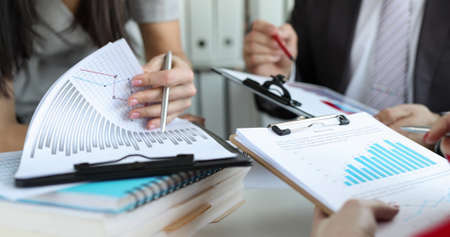 Collaboration of business analysts and marketers closeup
