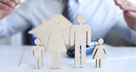 Insurance agent protects family and property closeup