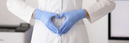 Woman showing heart sign with handsの写真素材