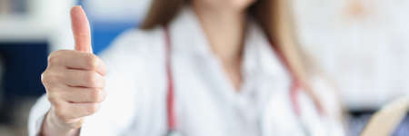 Doctor showing thumb up gestureの写真素材