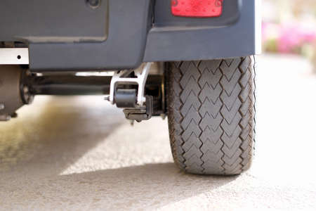 Rubber black car wheel standing on asphalt closeupの写真素材