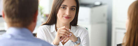Joyful female working with clients