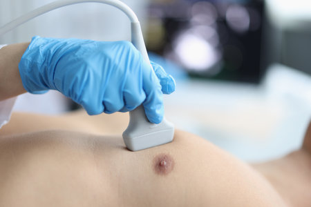 Medical worker investigating man heart, patient on appointment in clinicの写真素材