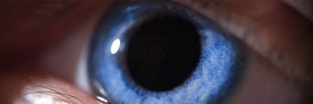 Closeup of beautiful bright blue human eyeの写真素材