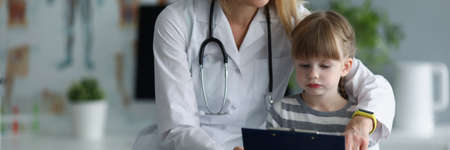 Mother doctor show to daughter medical history of patient