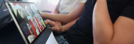 Couple flying on new year day and watch congratulations from friends online