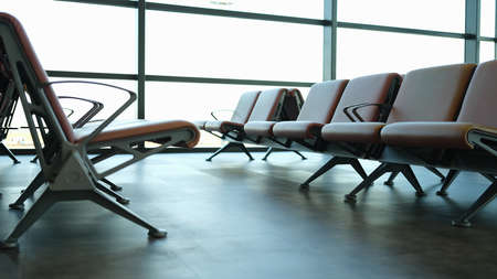 Empty brown leather chairs in airport loungeの写真素材